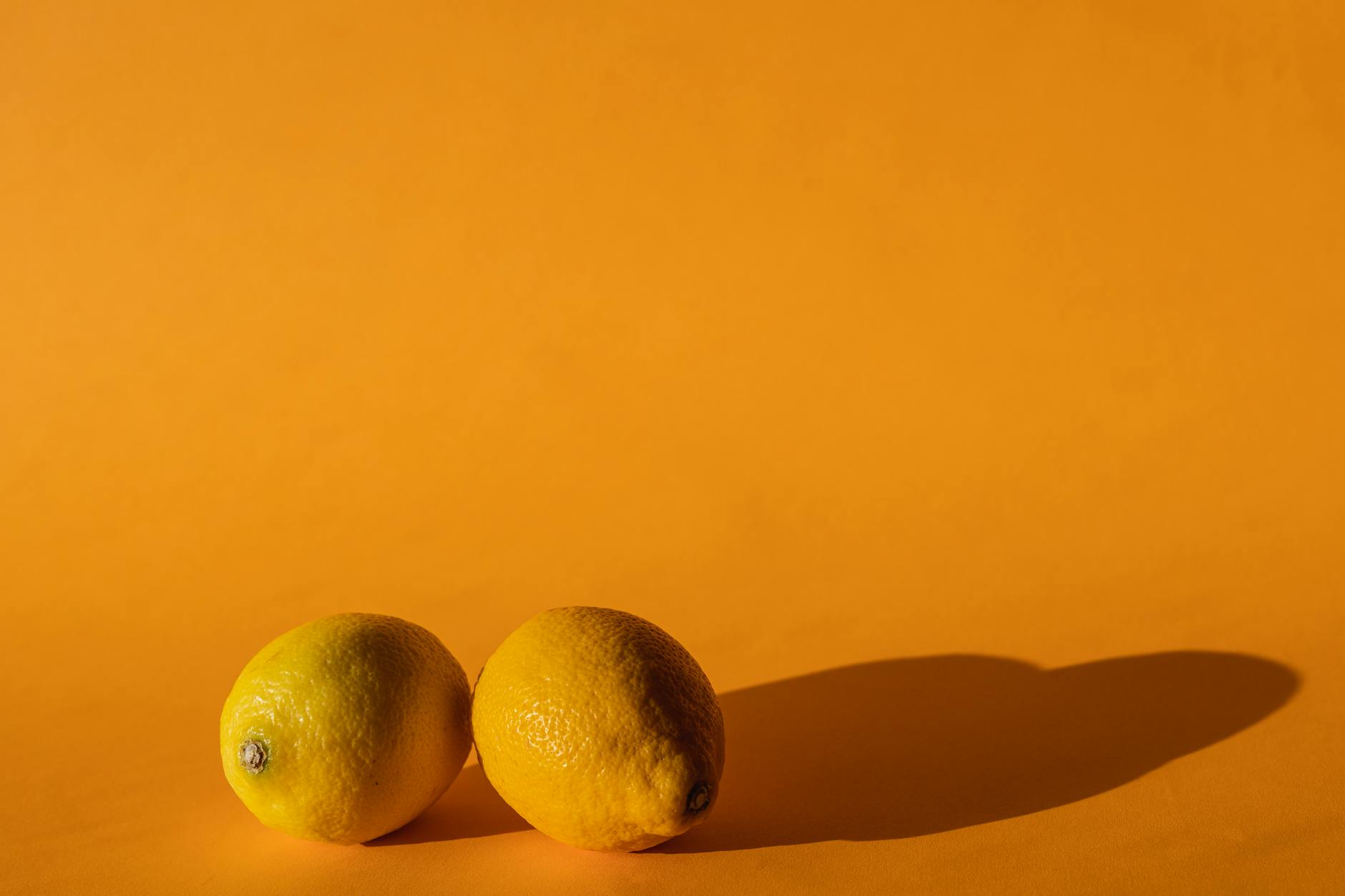 Vibrant collection of various sensual wellness devices on a bright yellow surface